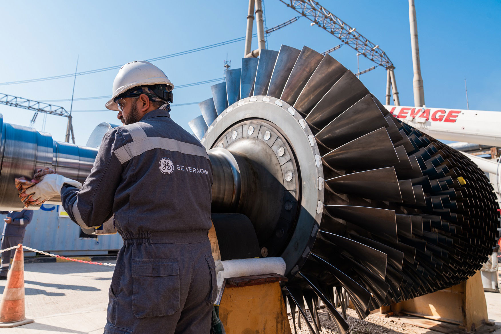 An employee is moving a turbine