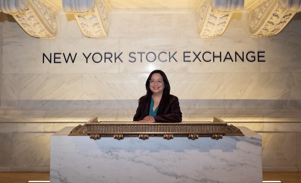 Woman standing in front of NYSE sign